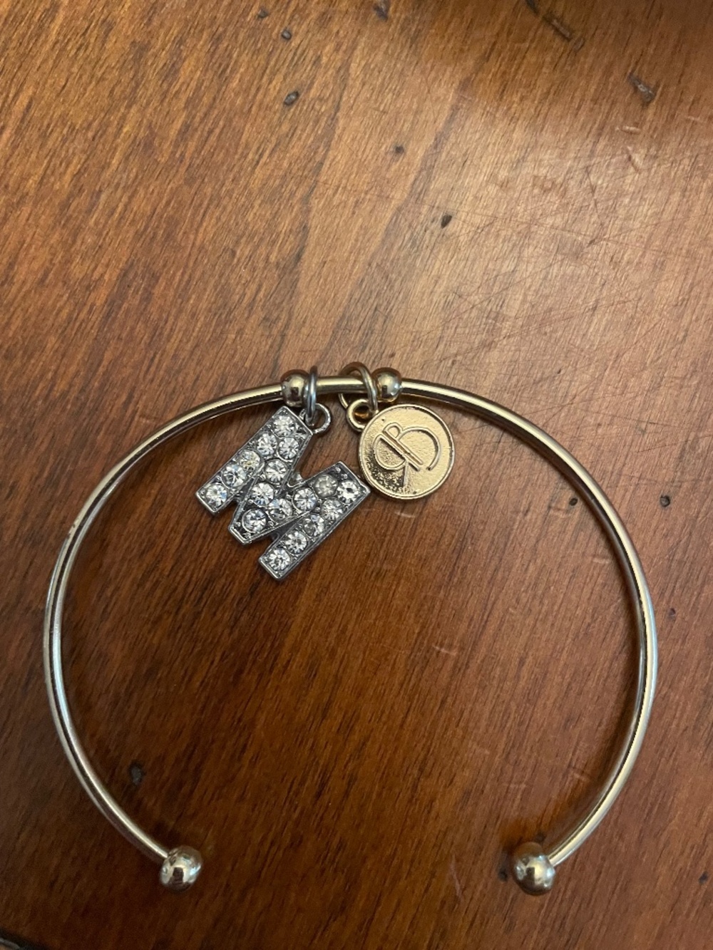 Gold tone cuff Bracelet with crystal “M”  charm